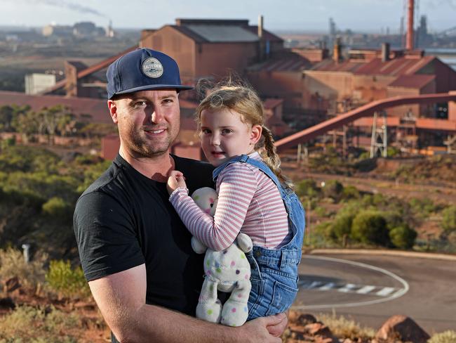 11/03/21 - Uncertainty surrounds the future of the Whyalla steel works. Alex Manners, mine worker, with 4-year-old daughter Lila on Hummock Hill in Whyalla.Picture: Tom Huntley