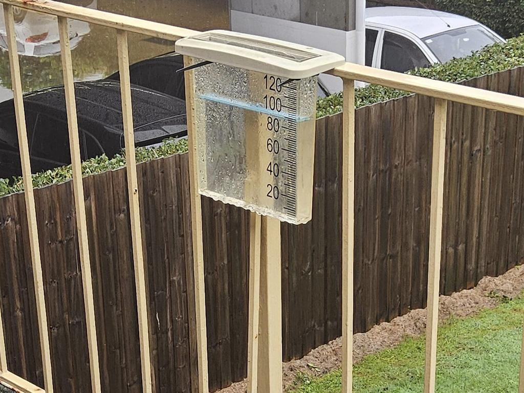 At 5am there was 10mm in this Redcliffe rain gauge, but just three hours later it was close to 90mm. Photo: Higgins Storm Chasing