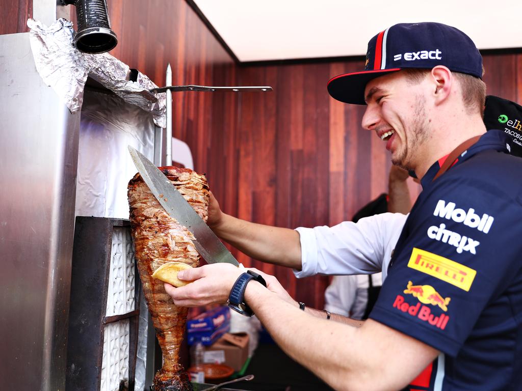 Max Verstappen otries his hand at preparing tacos in the paddock. (Photo by Mark Thompson/Getty Images)