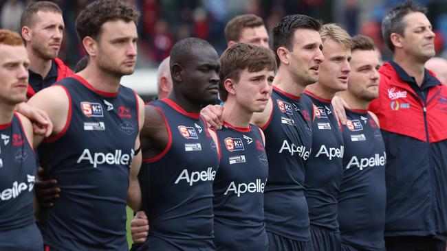 The emotion shows on the faces of the Norwood players during the pre-game tribute to Nick Lowden at Norwood Oval. Picture: David Mariuz/SANFL