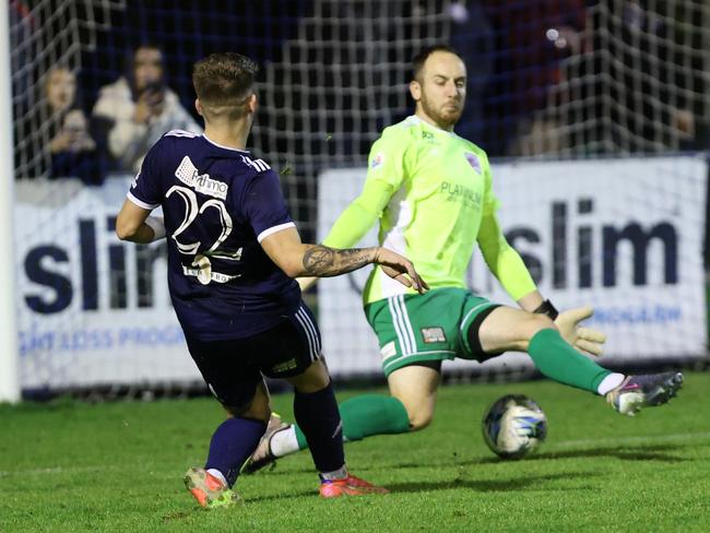 Stefan Valentini slots the ball past the Port Melbourne goalkeeper. Picture: Oakleigh Cannons FC