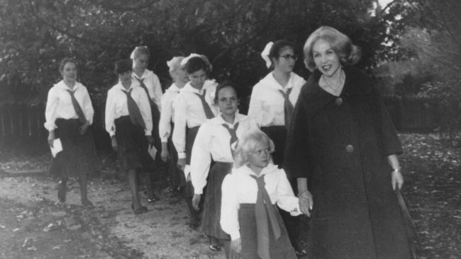 Anne Hamilton-Byrne, 'The Family' leader with children on the banks of Lake Eildon.