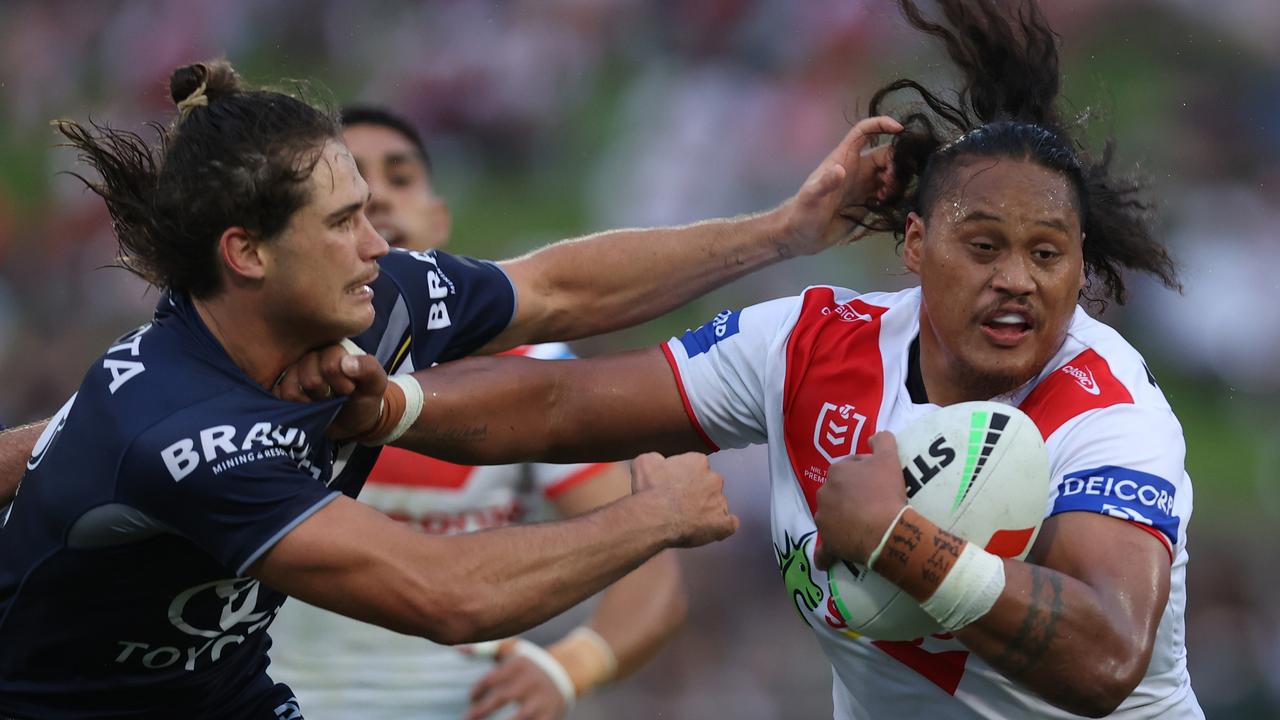 Luciano Leilua of the Dragons is tackled by Tom Chester. (Photo by Jason McCawley/Getty Images)