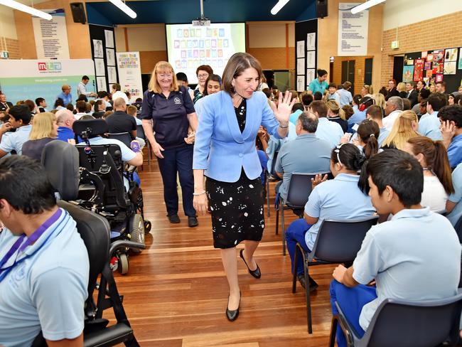 NSW Premier Gladys Berejiklian waves goodbye to students at Holroyd School at Merrylands. Picture: AAP IMAGE / Troy Snook