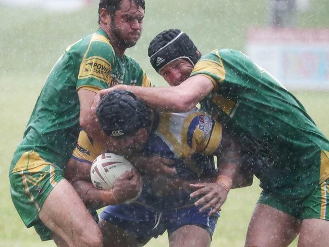 Kangaroos' Alphonse Gima pushes his way through the Gladiators defence in the Cairns and District Rugby League (CDRL) match between the Kangaroos and the Mareeba Gladiators, held at Vico Oval, Mooroobool. Picture: Brendan Radke