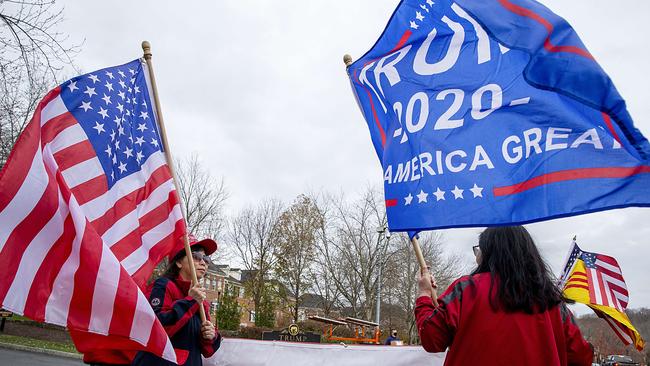 Supporters of US President Donald Trump wait to see him to leave Trump National Golf Club in Virginia. Picture: Tasos Katopodis/Getty Images