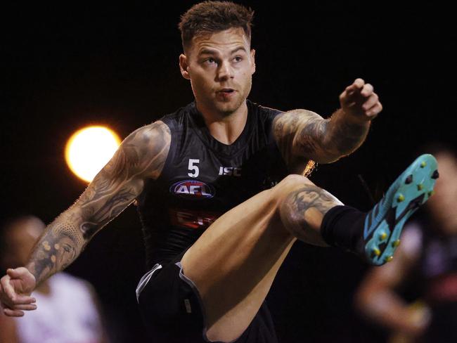 Jamie Elliott warms up for the Magpies’ semi-final against Geelong at a night training session. Picture: Michael Klein