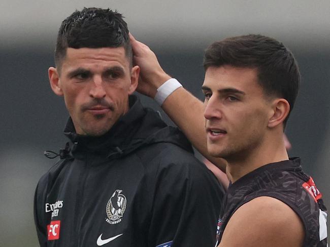 MELBOURNE, AUSTRALIA - JULY 31: Nick Daicos of the Magpies (R) pats Scott Pendlebury of the Magpies on the head during a Collingwood Magpies AFL training session at Olympic Park Oval on July 31, 2024 in Melbourne, Australia. (Photo by Daniel Pockett/Getty Images)