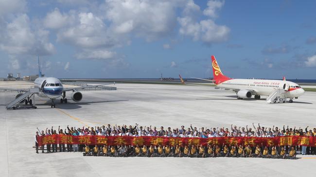 A pair of Chinese civilian jet airliners landed at an airfield on the newly created Fiery Cross Reef in the Spratly Islands to see whether it was up to standard. It is China's largest man-made island. Picture: Xing Guangli/Xinhua via AP.