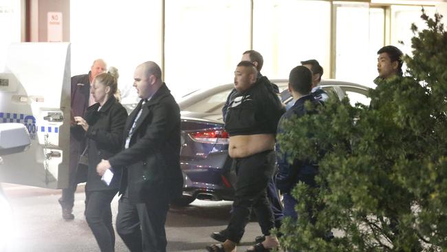 Haydar Albaseri being led away by police after his alleged tirade at nurses. Picture: Steve Tyson