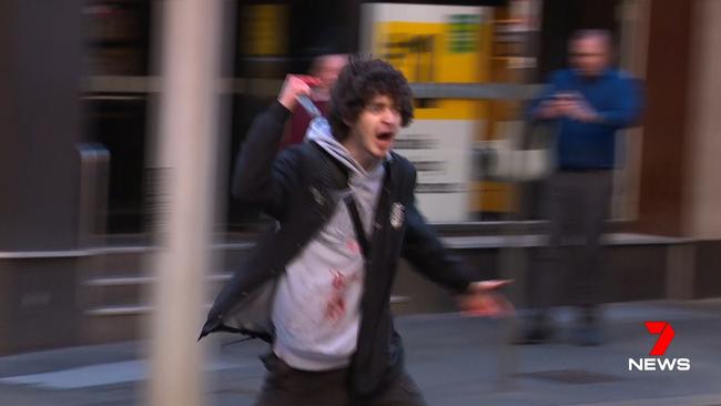 Ney was arrested in the CBD after he was pinned down by a group of bystanders. Picture: Seven News