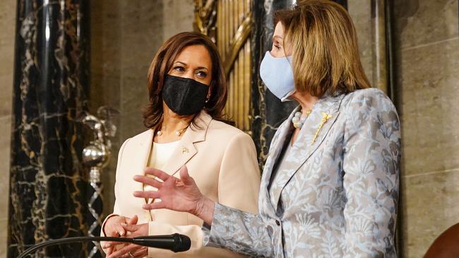 Vice President Kamala Harris (L), and Speaker of the House Nancy Pelosi (D-CA), talk before the start of President Joe Biden's address.