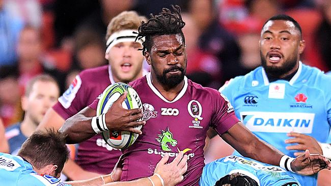 BRISBANE, AUSTRALIA - JUNE 02:  Moses Sorovi of the Reds is tackled during the round 16 Super Rugby match between the Reds and the Waratahs at Suncorp Stadium on June 2, 2018 in Brisbane, Australia.  (Photo by Albert Perez/Getty Images)