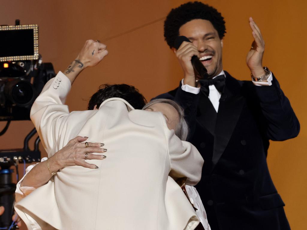 Harry Styles accepts the Album Of The Year award with Grammys host Trevor Noah. Noah mocked Prince Harry’s frostbite revelation in Spare. Picture: Kevin Winter/Getty Images for The Recording Academy