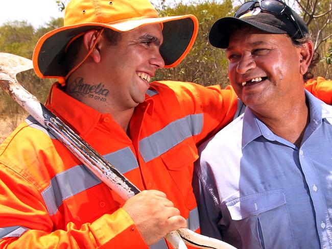 Aboriginal Graduate Dylan Quinlan 19 , who will be spared a prison sentence because of the programme , with founder and leader of the programme , Colin Saltmere as they work on the side of the highway ,after completing the pre-employment training during a 13-week residential program run by Myuma at Dugalunji Camp, east of Camooweal , far North West , QLD