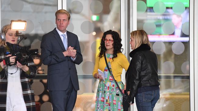 Senior ABC journalist Annabel Crabb speaks to comedian Mark Humphries outside the ABC offices.