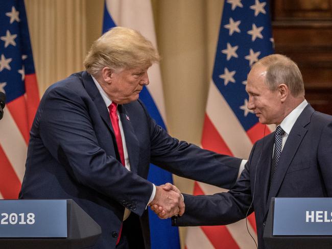 HELSINKI, FINLAND - JULY 16:  U.S. President Donald Trump (L) and Russian President Vladimir Putin shake hands during a joint press conference after their summit on July 16, 2018 in Helsinki, Finland. The two leaders met one-on-one and discussed a range of issues including the 2016 U.S Election collusion.  (Photo by Chris McGrath/Getty Images)