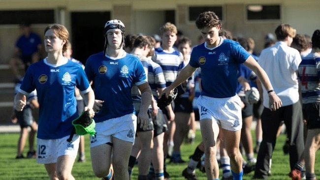 St Edmund's College First XV rugby team running out to play.