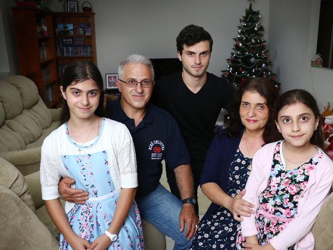 13/12/18: Moussa Seecy with his wife Tina, son Marcus 18 and daughters Marian, 11 and Mariah, 9 at their Emu Heights home in western Sydney. He's a member of the Christian Democrats. Supports a Religious Discrimination Act. John Feder/The Australian.