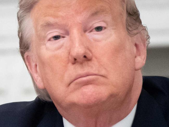 US President Donald Trump holds a roundtable discussion with Governors about economic reopening of closures due to COVID-19, known as coronavirus, in the State Dining Room of the White House in Washington, DC, June 18, 2020. (Photo by SAUL LOEB / AFP)