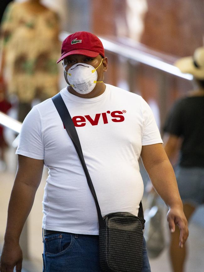 A man wearing a face masks at Chatswood. Picture: Brendan Read