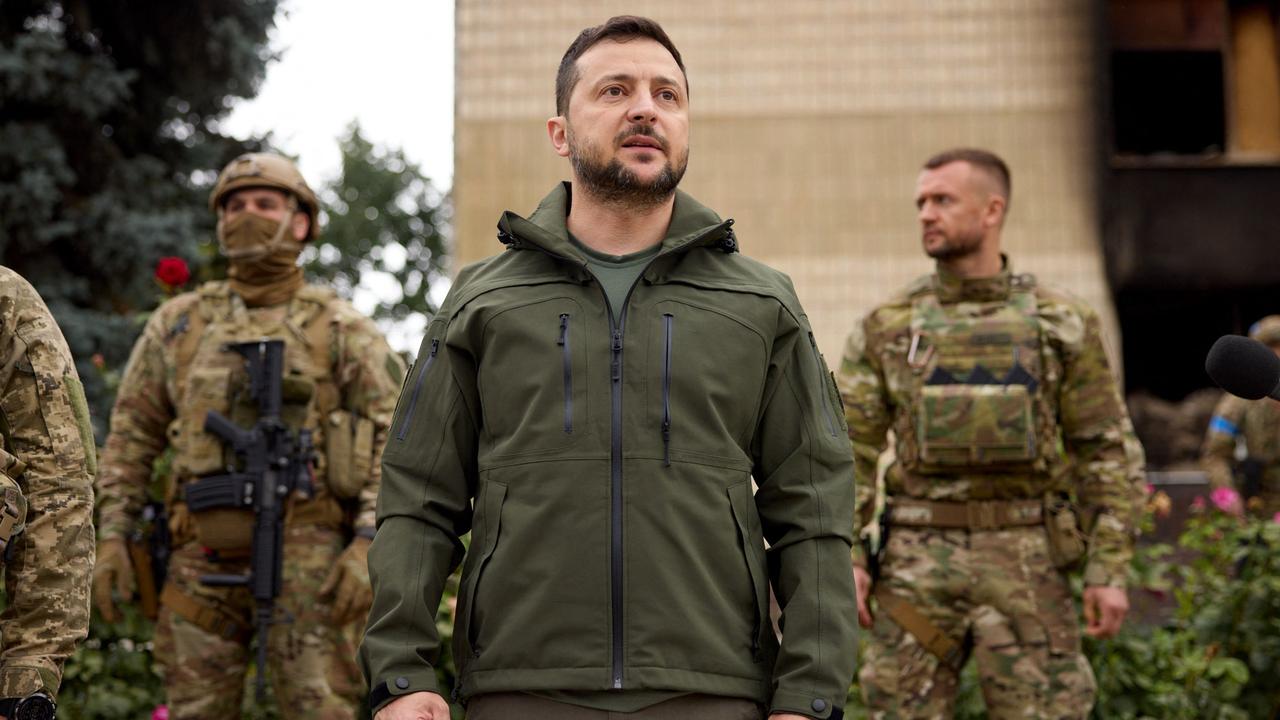 Ukrainian President Volodymyr Zelensky taking part in a flag raising in the city of Izyum, Kharkiv region last week. Picture: AFP