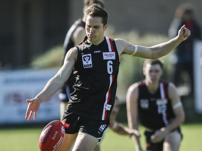 Lachlan Williams boots Frankston into attack against Northern Blues last year. Picture: Valeriu Campan