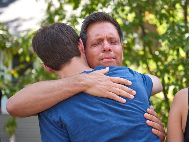 Don Damond, Justine’s fiance, hugs a neighbour after speaking to the media in Minneapolis. Picture: Jules Ameel/News Corp Australia