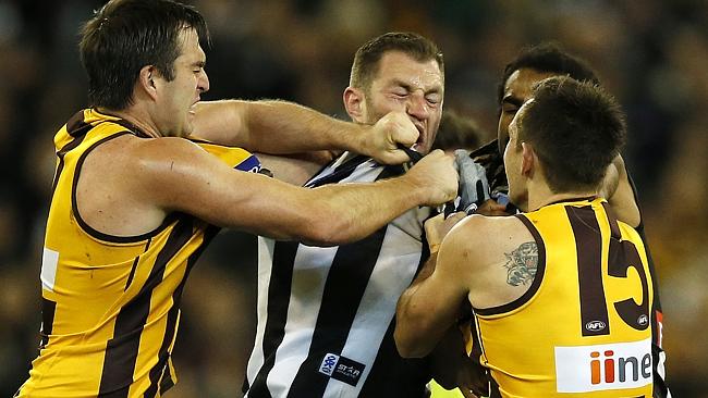  Hawthorn v Essendon. Telstra Dome. Second Term. Luke Hodge wrestles andrew Welsh after he put down Sam Mitchell. 