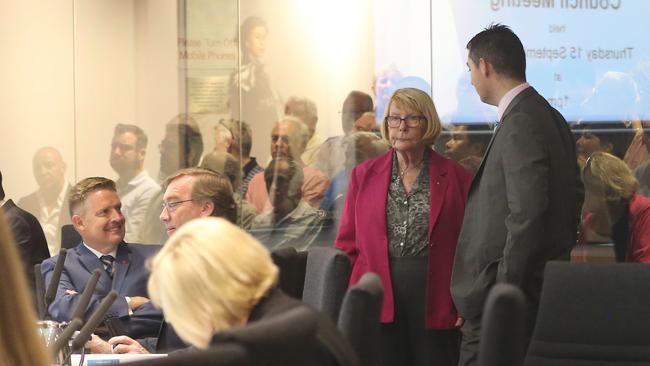 Behind Cr Dawn Crichlow and Cr Hermann Vorster (standing), the glass wall fronting residents in the public gallery at Evandale. Picture Glenn Hampson