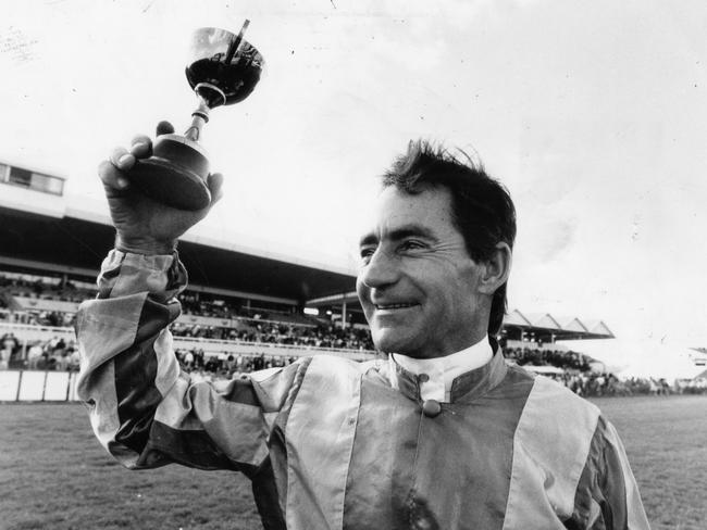 Harry White holds the aloft after winning the West End Adelaide Cup race at Morphettville Racecourse, aboard Ideal Centreman in 1991.