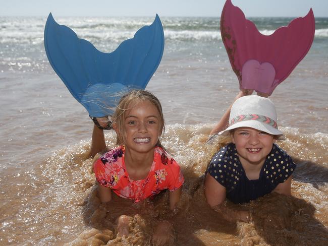 Amelie Shelley, 8, and Matilda Baxter savouring the deliciously cool waves Dee Why.