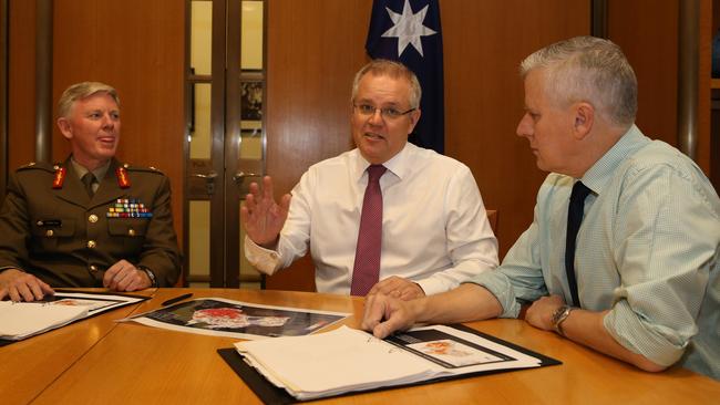 National Drought co-ordinator Major General Stephan Day meets with PM Scott Morrison and Deputy PM Michael McCormack in Canberra on Saturday. Picture: Kym Smith