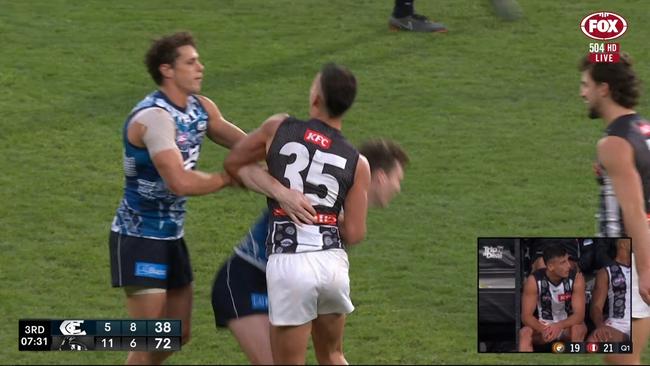 Nick Daicos punches Acres.