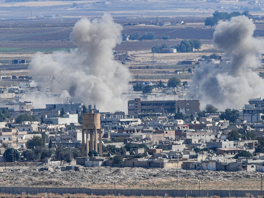 Smoke rising from the Syrian town of Ras al-Ain, from the Turkish side of the border at Ceylanpinar district in Sanliurfa, on the first week of Turkey's military operation. Picture: AFP