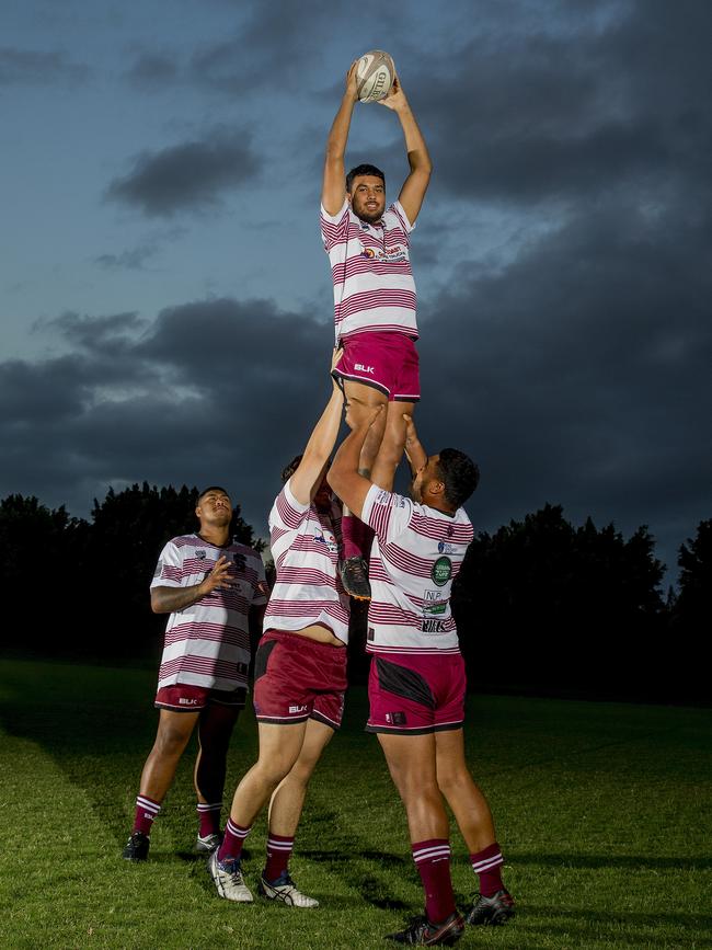 The Nerang Bulls will field five first cousins in their team to take on reigning premiers Helensvale Hogs in Sunday's GCDRU grand final. Tyran Isaac being lifted up . Picture: Jerad Williams