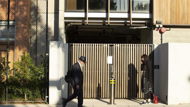 A shocked teacher at one of the gates to Yeshivah-Beth Rivkah colleges. Picture: Sarah Matray