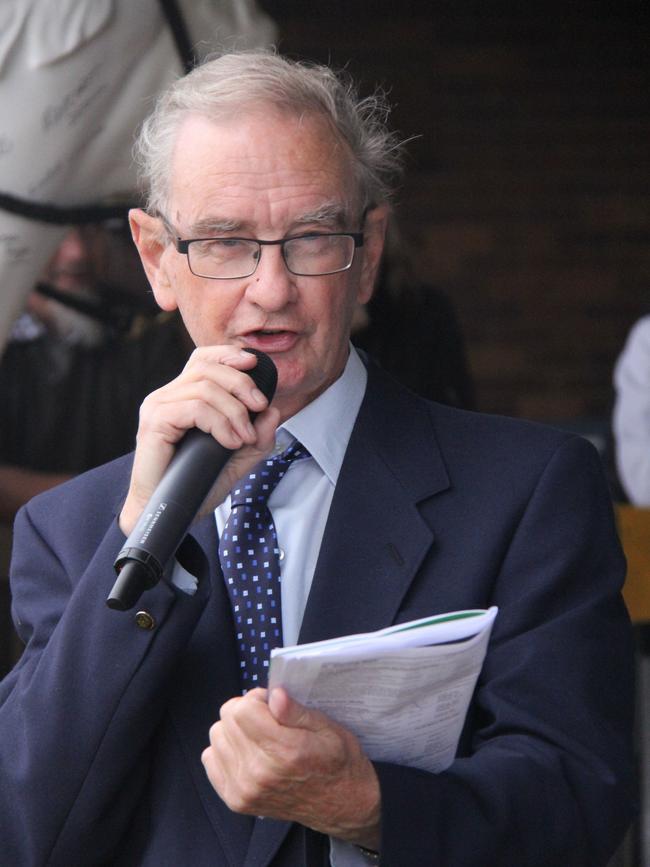 AND THEY'RE RACING: Barry Fitzhenry mans the microphone in the mounting enclosure.