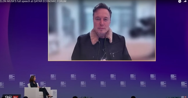 Elon Musk speaks remotely at the Qatar Economic Forum, defending Tesla's sales performance and reaffirming his role as CEO despite growing backlash. Picture: YouTube