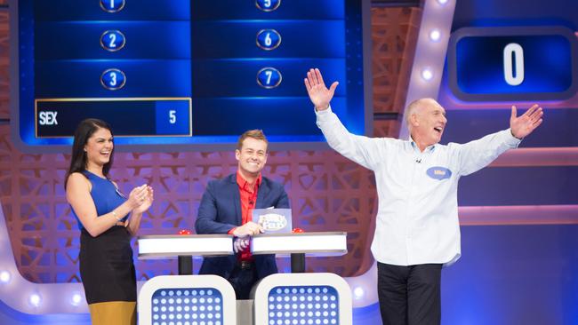 Family Feud Supplied by channel 10. Dimitra Kavadias and Mike Hammond with Grant Denyer.
