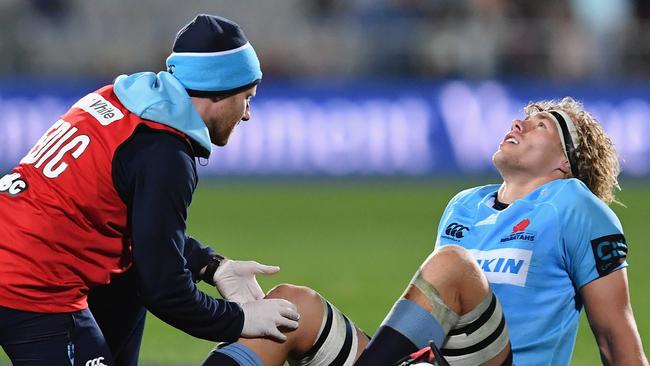 CHRISTCHURCH, NEW ZEALAND — MAY 12: Ned Hanigan of the Waratahs receives medical help during the round 12 Super Rugby match between the Crusaders and the Waratahs at AMI Stadium on May 12, 2018 in Christchurch, New Zealand. (Photo by Kai Schwoerer/Getty Images)