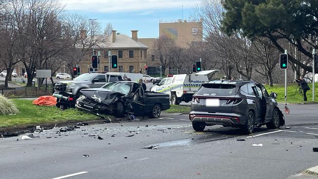 Emergency services block off the scene where a two vehicle fatal crash killed an 18-year-old man from Hobart and three others. Brooker Highway and Bathurst St intersection. July 21, 2024.