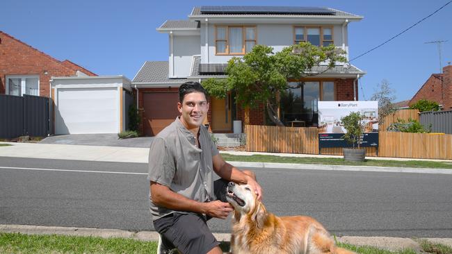 Not all homebuyers will be hit by the borrowing capacity crunch, and those with significant equity like Aaron Kandiah, with dog Winston, and his partner are selling up now in anticipation of further market stress that could help them jump up the property ladder. Picture: David Crosling