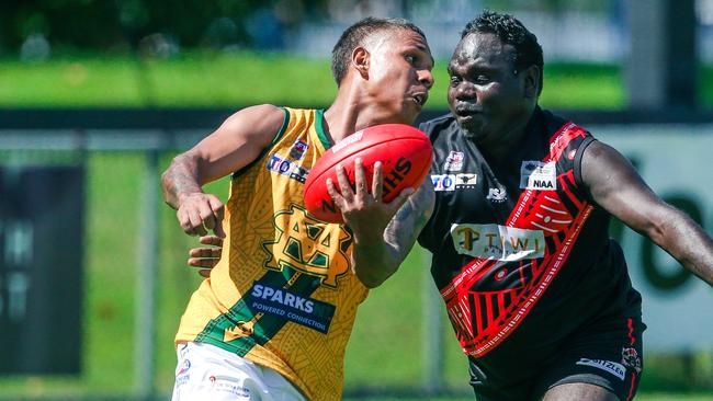 Nick Yarran unloads under pressure from Roy Farmer as St MaryÃs V Tiwi Bombers at TIO Stadium in round 2 of the NTFL 22-23 Comp.Picture Glenn Campbell