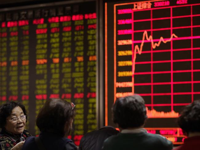 Took a dive ... Trading on the Shanghai and Shenzhen stock exchanges in China was frozen for the day after shares tumbled more than seven per cent. Picture: AP/Andy Wong