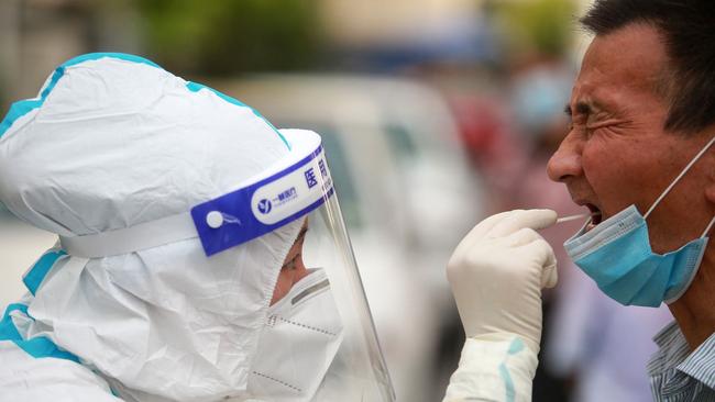 A man receives nucleic acid tests for Covid-19 in Yangzhou in China's eastern Jiangsu province. Picture: AFP