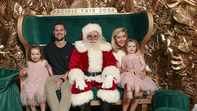 Tom and Sophie Elliott with their daughters Francesca and Mia as Santa arrives at Pacific Fair. Picture Glenn Campbell