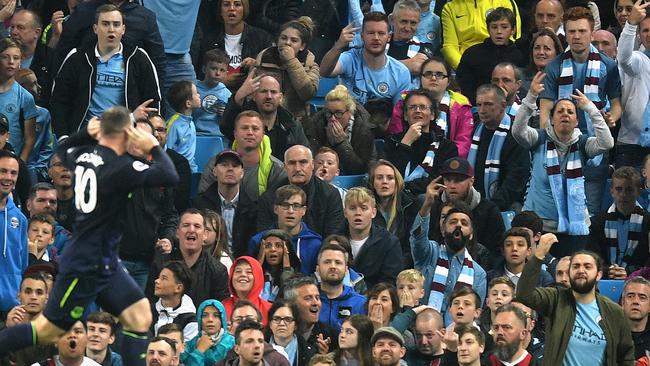 Wayne Rooney loves celebrating in front of Manchester City fans.