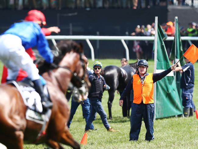 MELBOURNE, AUSTRALIA - NOVEMBER 06:  Jockey Kerrin McEvoy riding Cross Counter winsbut is guided away from  Cliffs Of Moher who broke down in the first lap race 7 the Lexus Melbourne Cup during Melbourne Cup Day at Flemington Racecourse on November 6, 2018 in Melbourne, Australia.  (Photo by Michael Dodge/Getty Images)