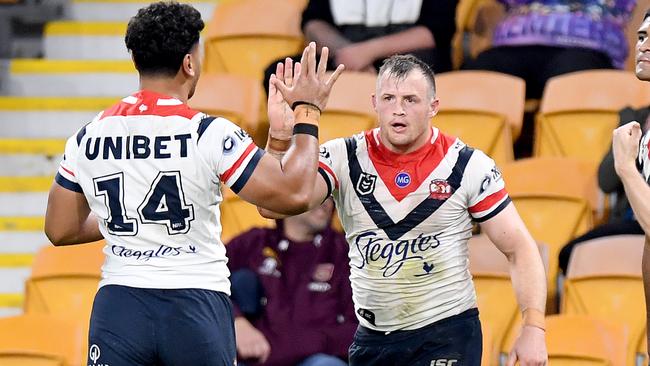 BRISBANE, AUSTRALIA - JULY 02: Josh Morris of the Roosters celebrates with team mates after scoring a try during the round eight NRL match between the Melbourne Storm and the Sydney Roosters at Suncorp Stadium on July 02, 2020 in Brisbane, Australia. (Photo by Bradley Kanaris/Getty Images)